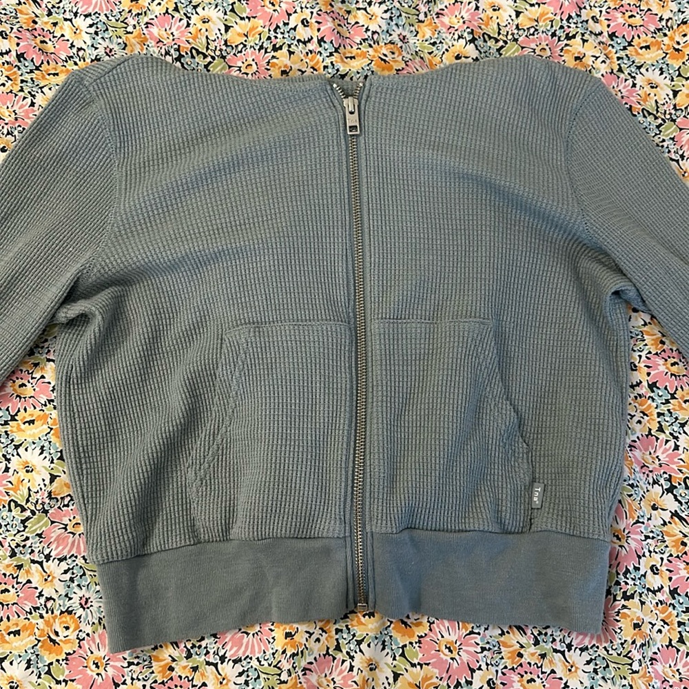 TNA crop zip up